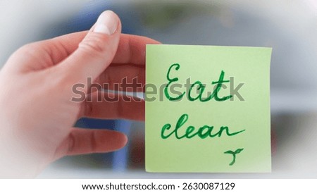 Sticky note reminders on kitchen fridge promoting healthy eating and wellness.