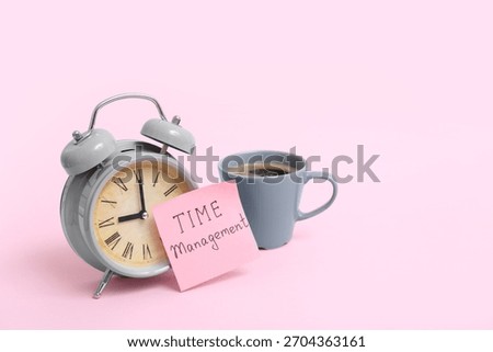 Sticky note with text TIME MANAGEMENT, alarm clock and cup of coffee on pink background