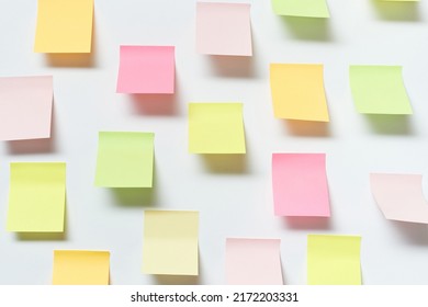 Sticky notes over white background.