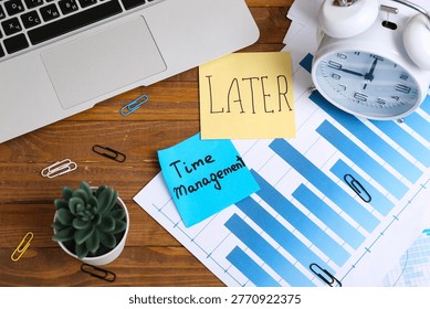 Sticky notes with text LATER, TIME MANAGEMENT, financial documents, alarm clock and laptop on wooden table
