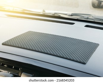 Sticky Pad Mat On Car Dashboard.