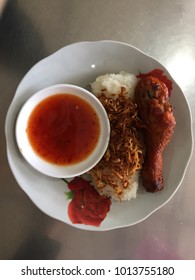 ‘Pulut Ayam’ - A Sticky Rice With Fried Chicken And Sauce.