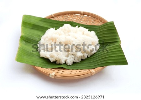 Sticky rice on banana leaf on white background.