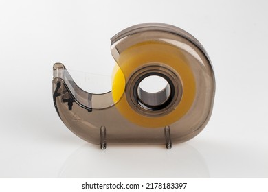 Sticky Tape Dispenser Containing Tape, Isolated On White Background