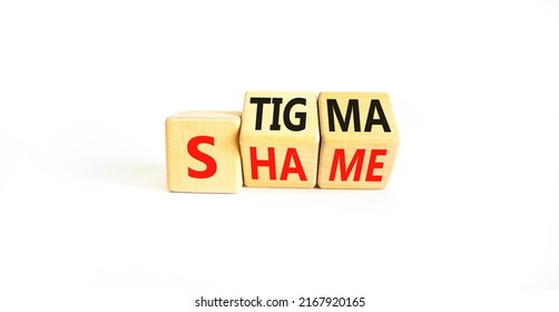Stigma or shame symbol. Concept words Stigma or Shame on wooden cubes. Beautiful white table white background. Business stigma or shame concept. Copy space.