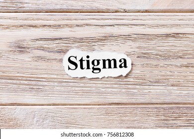 Stigma of the word on paper. concept. Words of Stigma on a wooden background.
