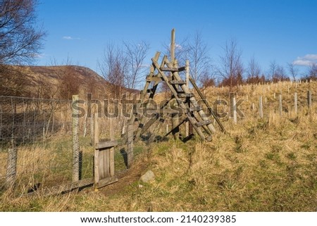 Stile over a fence on the Rob Roy way near to Amulree in Perthshire Foto stock © 