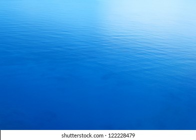 Still Blue Sea Water Surface As Background