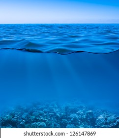 still calm sea water surface with clear sky  and underwater world discovered