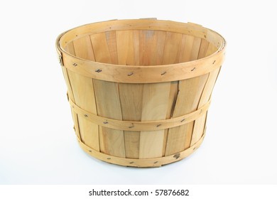 Still image of front view of wooden bushel over white background.