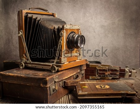 Still image of old camera equipment on old wooden floor