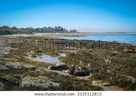 Still landscape image of Malahide beach - Rocky coastline and view over Irish Sea at Malahide, Ireland
