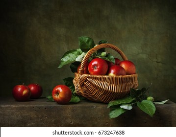 Still life with apples in a basket - Shutterstock ID 673247638