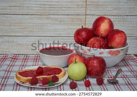 still life with apples and raspberry jam, Fresh autumn harvest, apples, berries and sweet fruit jam.