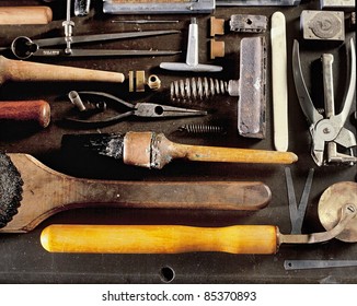 Still life of an assortment of tools used for hand book binding