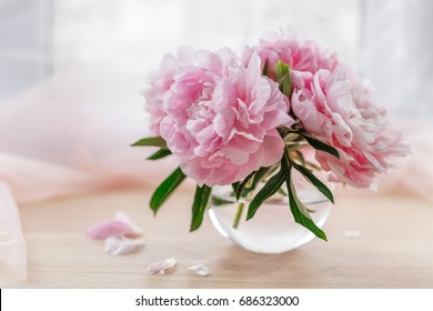 Still life with beautiful pink peonies in glass vase - Powered by Shutterstock