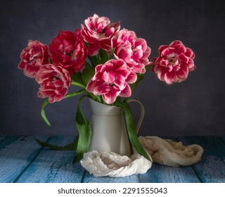 Still life with beautiful red-white tulips and a jug. - Shutterstock ID 2291555043