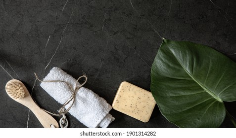 Still Life With Body Brush, Towel And Soap On A Dark Marble Surface Copy Space. Body Care Concept.