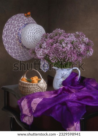 Still life with bouquet of purple flowers  and apricots