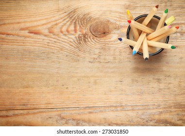 Still life, business, education concept. Pencils in a mug on a wooden table. Selective focus, copy space background, top view - Powered by Shutterstock