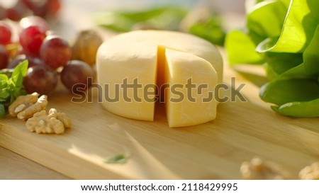 Still life of Cheese served with green, grape and walnut