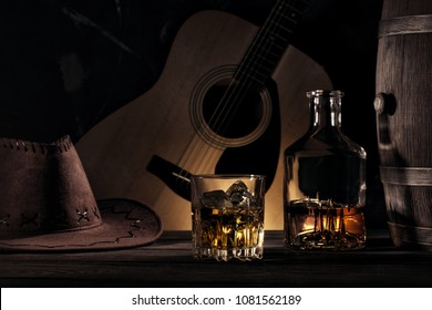 Still life in cowboy style on guitar background