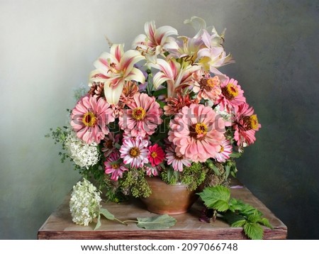 Still life with cynias on a multicolored background.Garden flowers in a bouquet