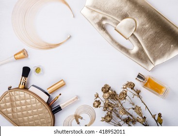 Still life of fashion woman. Feminine cosmetic background.Women's set of fashion accessories in golden color.Copy space.selective focus. - Shutterstock ID 418952011