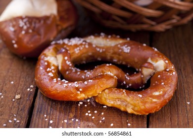 Still life of fresh pretzel with salt