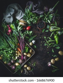 Still Life Of Fresh Vegetables, Herbs And Berries. Top View, Flatlay On Dark Wooden Background. Healthy Eating Concept.