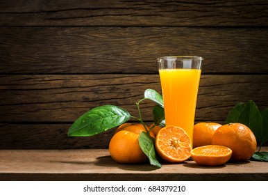 Still Life Glass of Fresh Orange Juice on Vintage Wood Table with Copy Space Background - Shutterstock ID 684379210