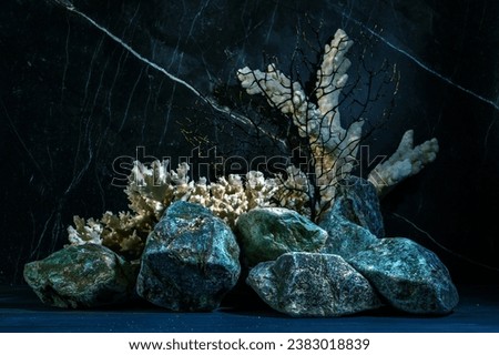 Still life with green stones and corals.