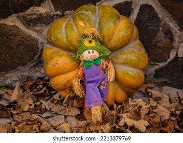 Still life for Halloween with a toy scarecrow