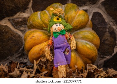 Still life for Halloween with a toy scarecrow