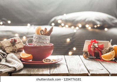 still life with home Christmas decor in the living room on a wooden table, the concept of celebration and home comfort - Powered by Shutterstock