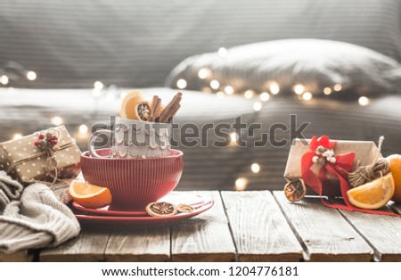 still life with home Christmas decor in the living room on a wooden table, the concept of celebration and home comfort