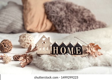 Still Life Home Decor In A Cozy House With Wooden Letters With The Inscription Home. The Concept Of Decor And Comfort .