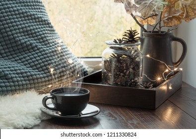 Still Life In Home Interior. Cozy Winter Or Autumn Cup Of Coffee At Home Warm Fluffy Furskin , Garland, Swedish Hygge Concept.