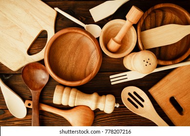 Still life from home kitchen utensils on a dark wooden background. View from above - Powered by Shutterstock