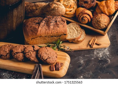 Still Life Image Of Home Made Bread And Cookies With Chocolates And Nuts, Dark Food Style Image