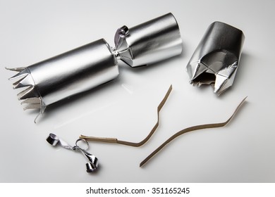 Still Life Image Of Single Single Christmas Cracker On Plain Background Open 