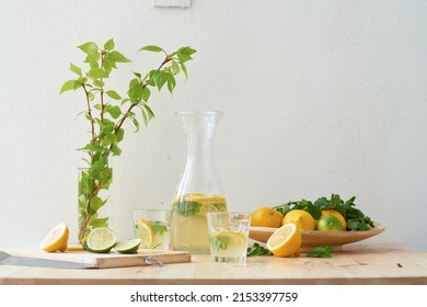 still life lemon drink decanter minimal background