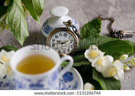 Still life with a magnificent tea set and jasmine flowers. Time to drink tea.
