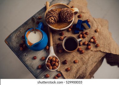 Still life morning coffee with chocolate cream and nuts in a brown and blue tones - warm shades - kitchen - sweets - candy
