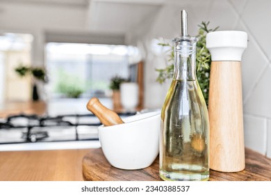 Still life with olive oil, salt grinder and mortar with pestle
 - Powered by Shutterstock