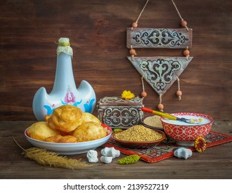 Still life on Nauryz (spring New Year's holiday) with Torsyk (a jug for koumiss), tolkan (coarse flour from fried barley or wheat), tary (fried millet), tumar (amulet), kurt, drink nauryz-kozhe - Shutterstock ID 2139527219