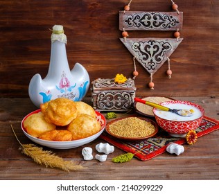 Still life on Nauryz (spring New Year's holiday) with Torsyk (a jug for koumiss), tolkan (coarse flour from fried barley or wheat), tary (fried millet), tumar (amulet), kurt, drink nauryz-kozhe - Shutterstock ID 2140299229