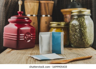 Still Life With Packet Of Yeast In The Foreground With Ingredients Behind