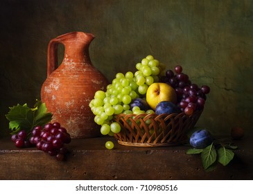 Still life with pears and grapes and plums - Shutterstock ID 710980516
