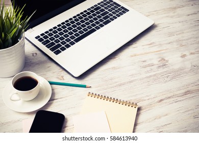 Still Life Photo Of Laptop Notepad Coffee Glasses And Other Stuff On Wooden Table